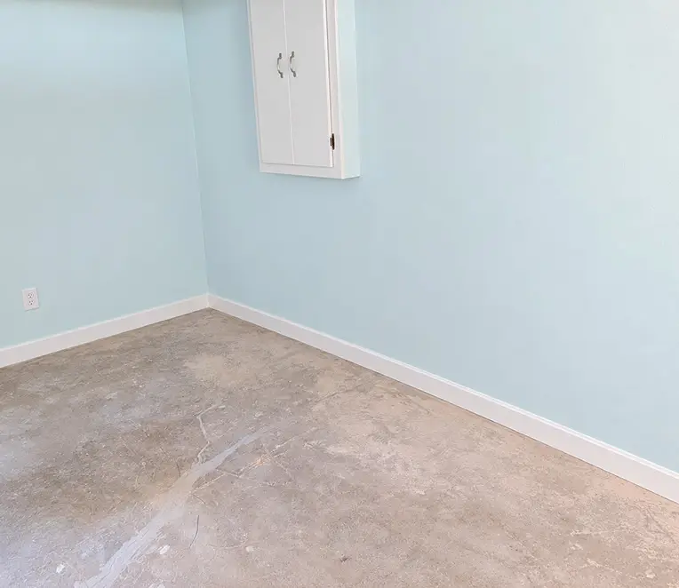 Basement wall restored after water damage drywall repair